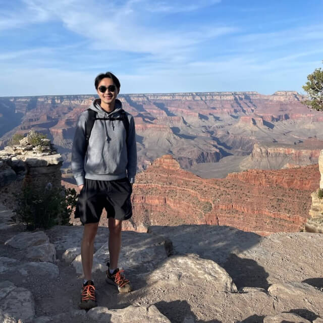 A portrait of Jonathan hiking in the Grand Canyon